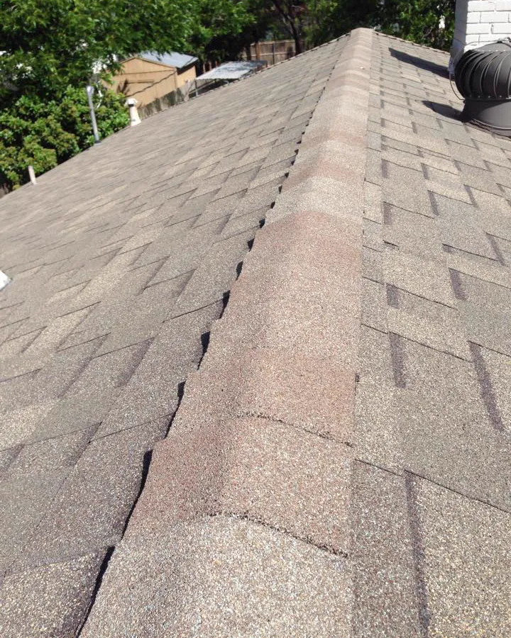 Looking up a shingle roof along the ridge line.